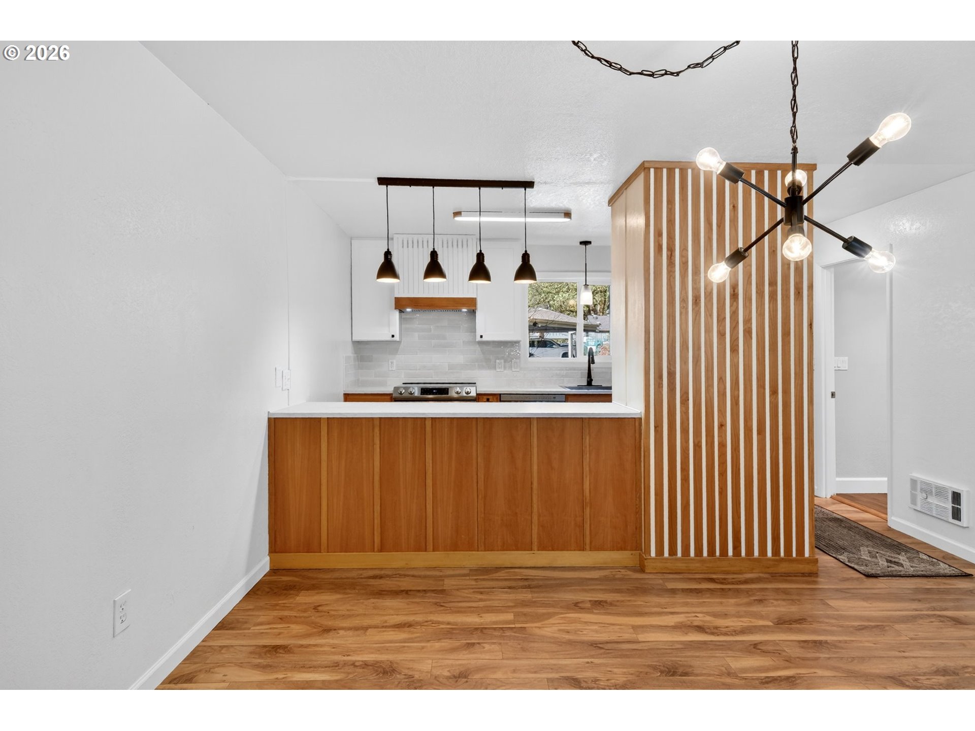 4 Touchstone, Unit 151 Lake Oswego, OR 97035 - Photo 10 of 28 a view of a kitchen with wooden floor and a ceiling fan
