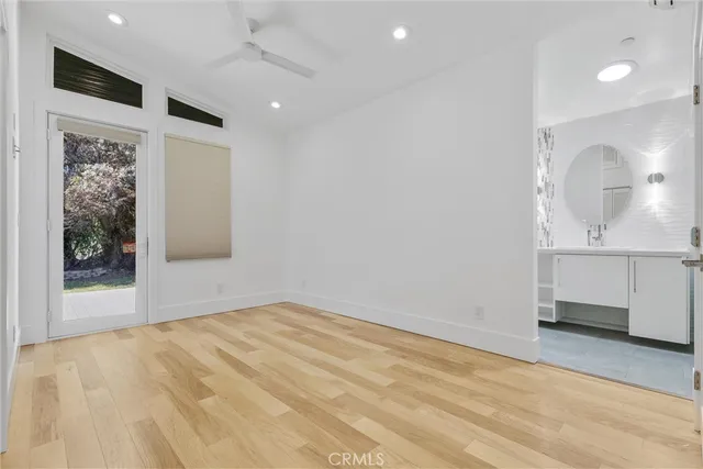 an aerial view of a house with garden space and street view