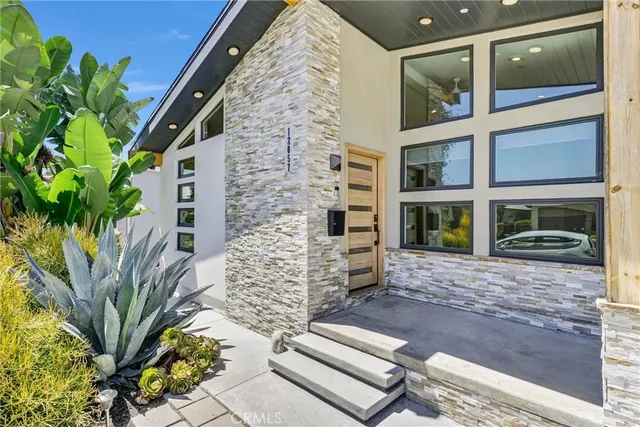 a spacious bathroom with a double vanity sink a mirror and shower