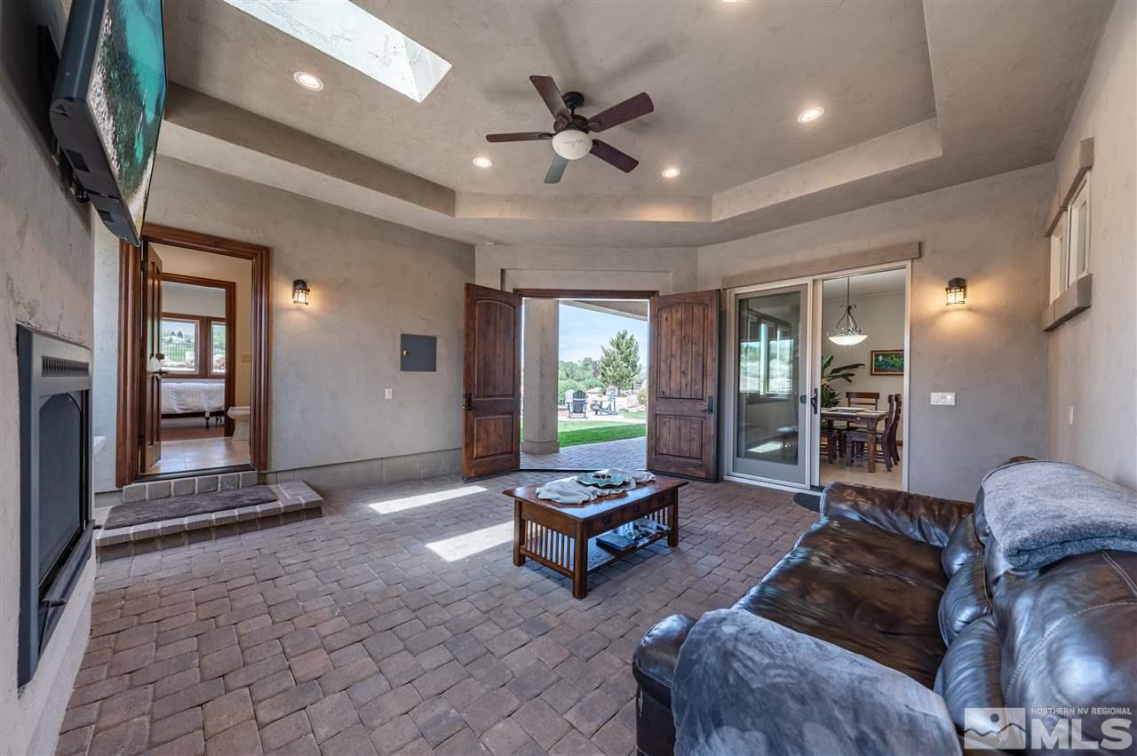 12835 Silver Wolf Road Reno, NV 89511 - Photo 13 of 31 a living room with furniture and wooden floor