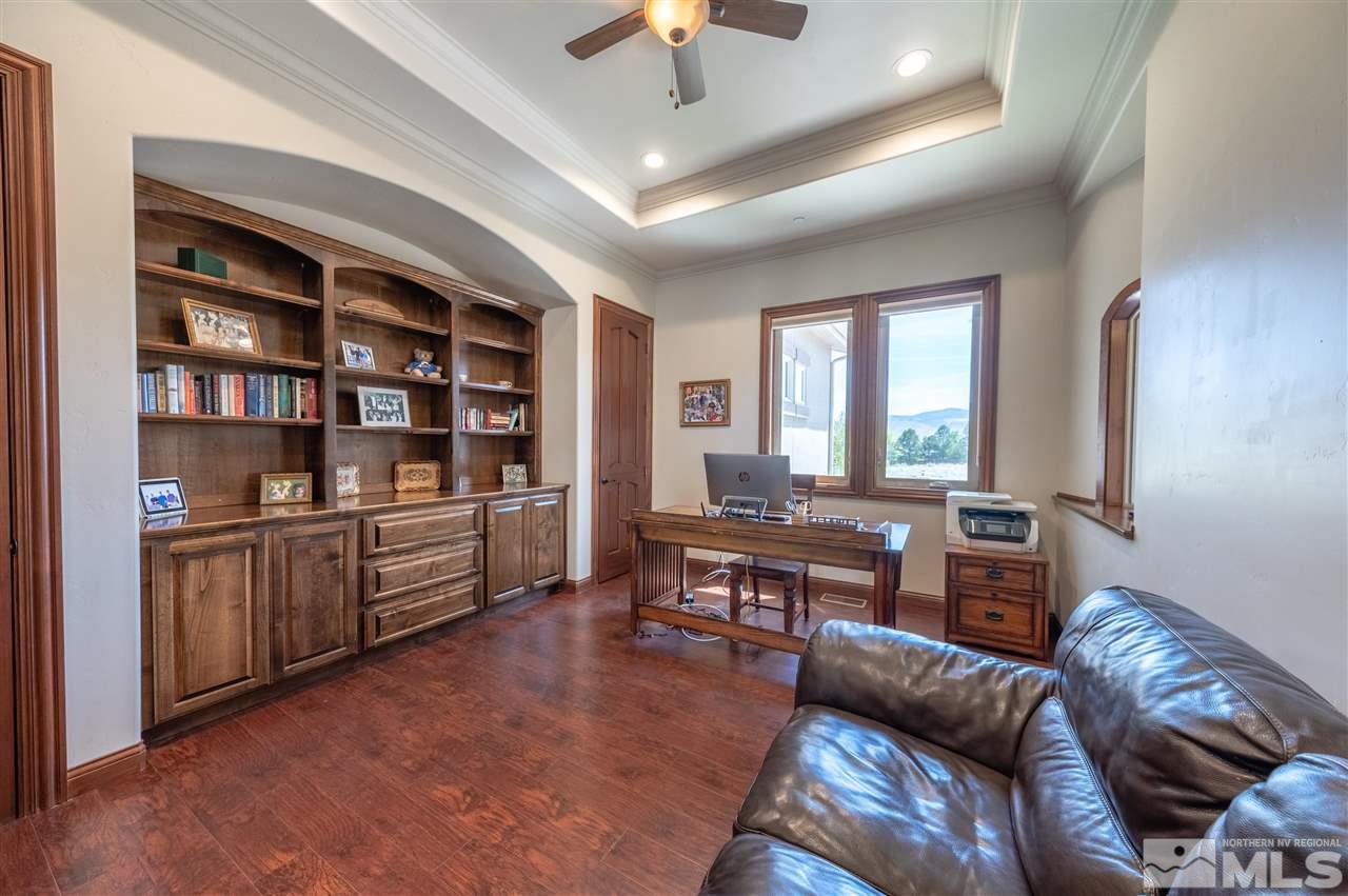 12835 Silver Wolf Road Reno, NV 89511 - Photo 16 of 31 a living room with furniture and a chandelier