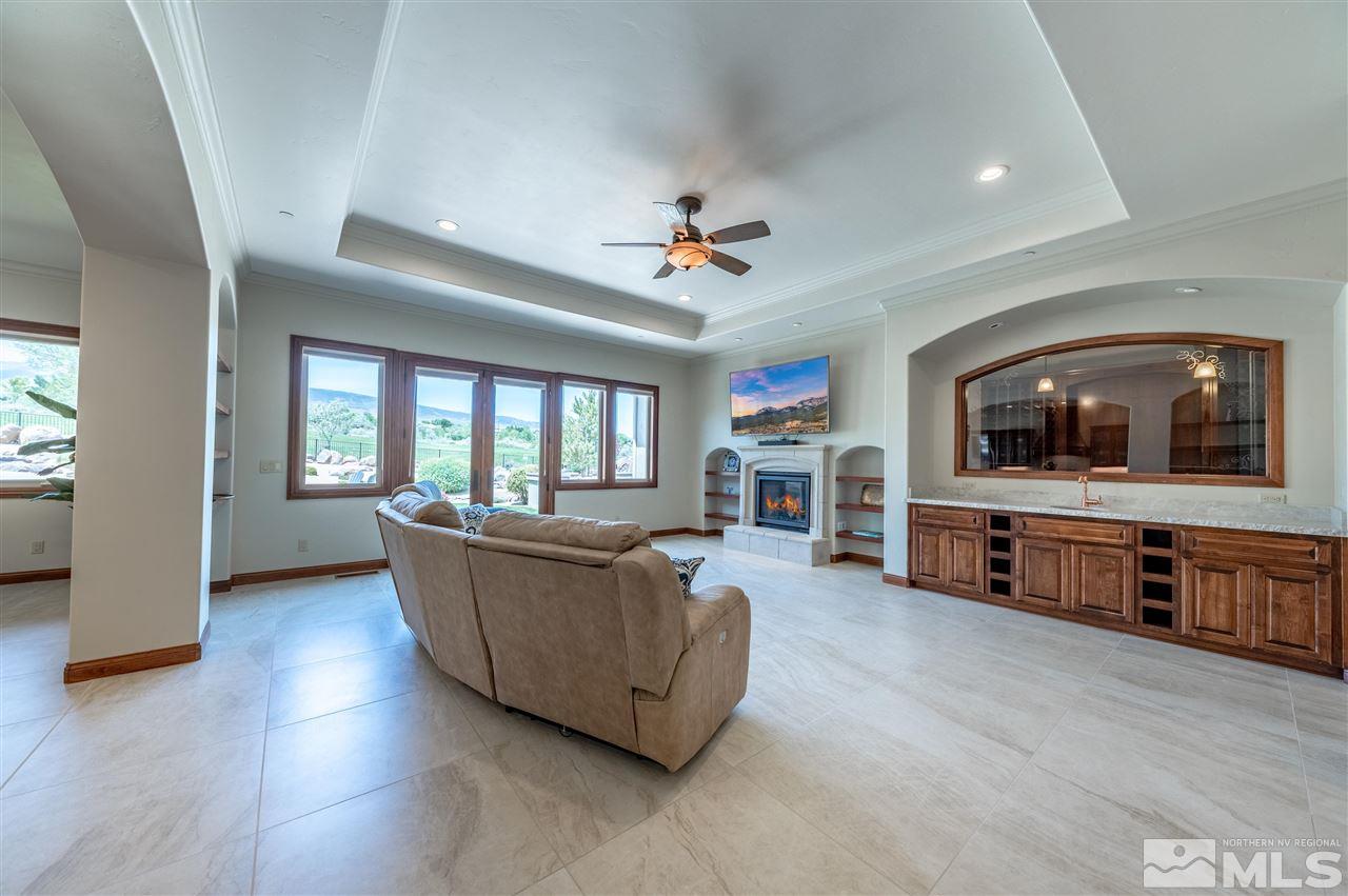 12835 Silver Wolf Road Reno, NV 89511 - Photo 5 of 31 a living room with furniture and a flat screen tv