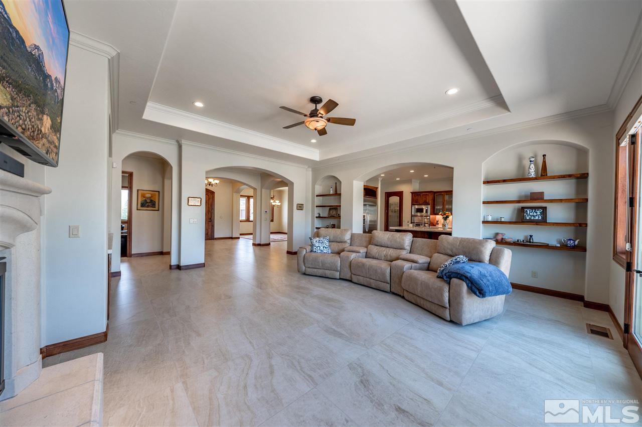 12835 Silver Wolf Road Reno, NV 89511 - Photo 7 of 31 a living room with furniture and a chandelier