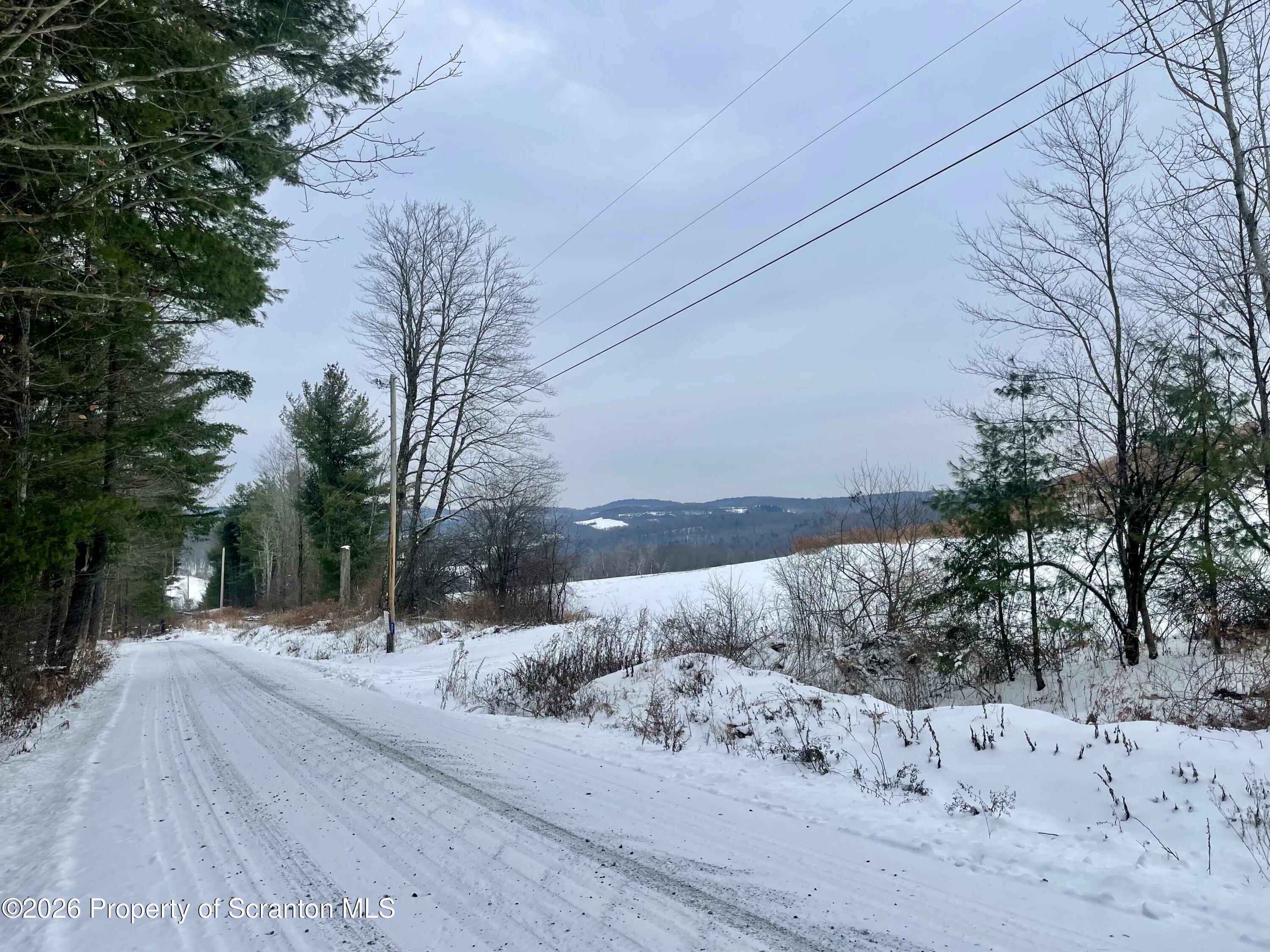 33 Arrowhead Road Little Meadows, PA 18830 - Photo 13 of 17 a view of a road with snow on the road