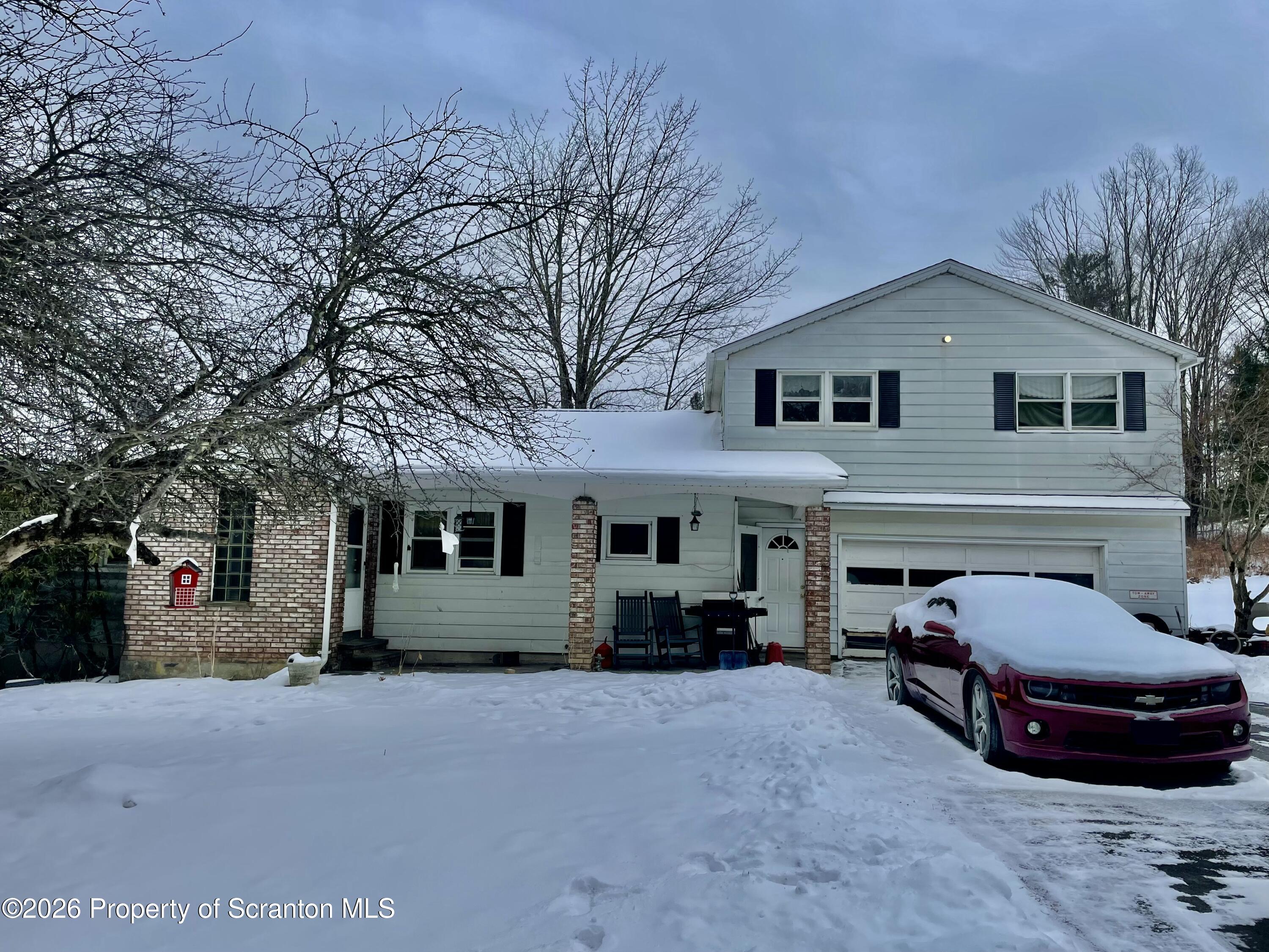 33 Arrowhead Road Little Meadows, PA 18830 - Photo 14 of 17 a view of house with outdoor space and parking