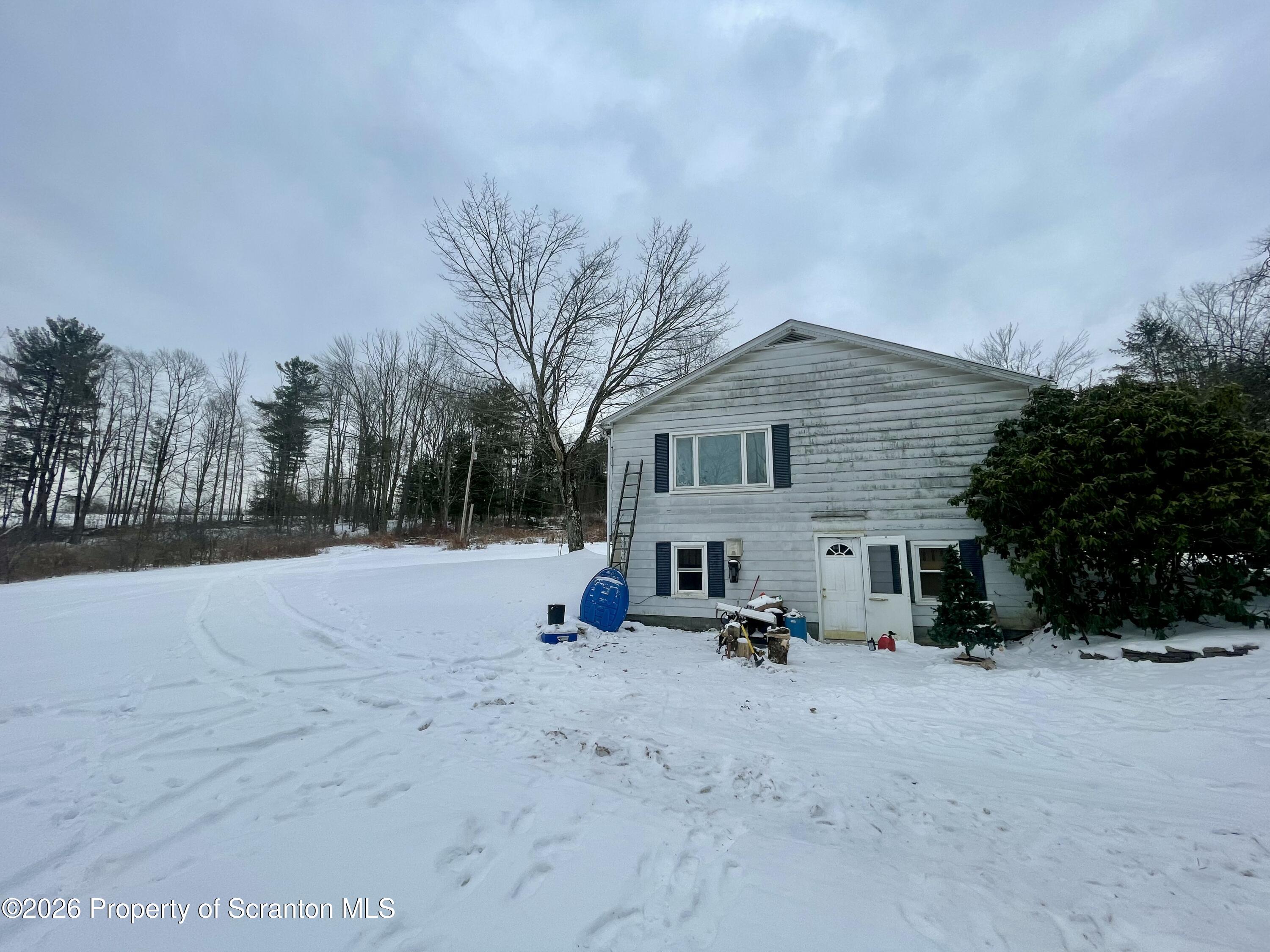 33 Arrowhead Road Little Meadows, PA 18830 - Photo 17 of 17 a view of a outdoor space with a house