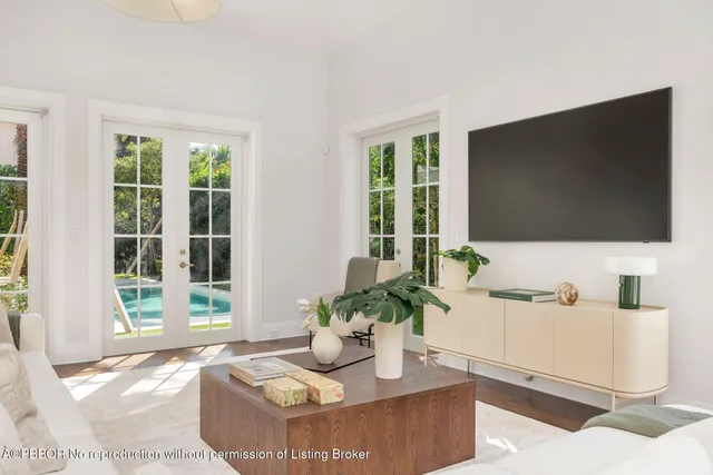 a living room with fireplace furniture and a flat screen tv