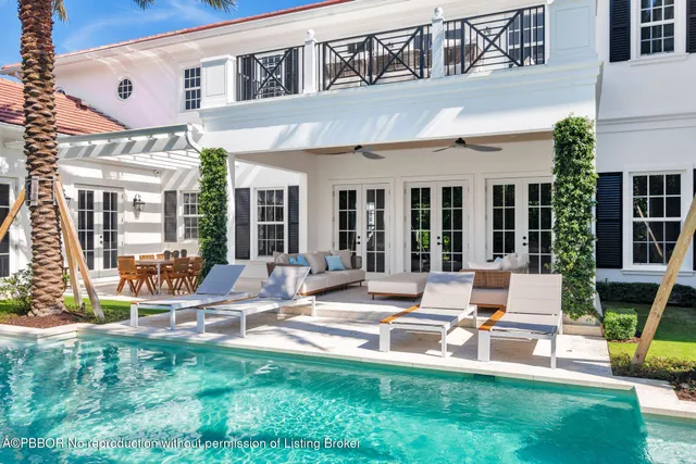 a view of a house with backyard porch and sitting area