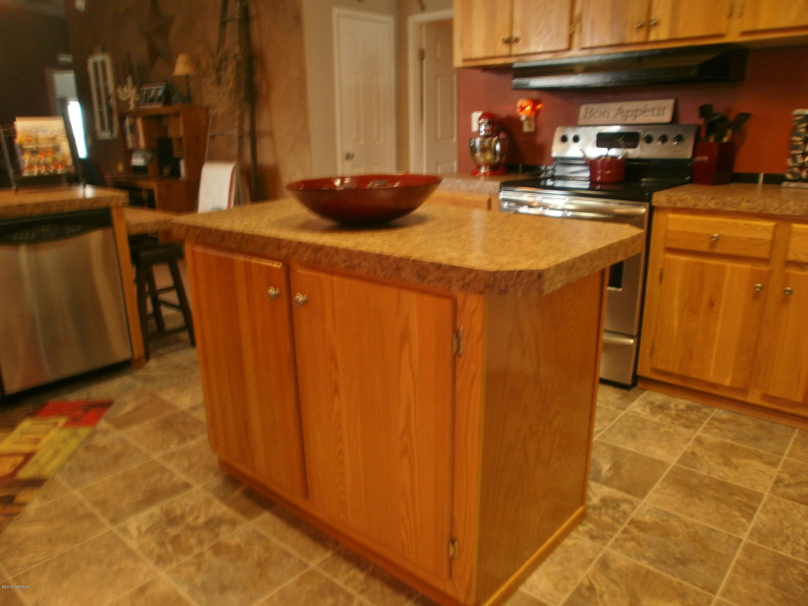 1771 Stone Road Yakima, WA 98908 - Photo 14 of 45 a kitchen with stainless steel appliances granite countertop a sink a stove and a refrigerator