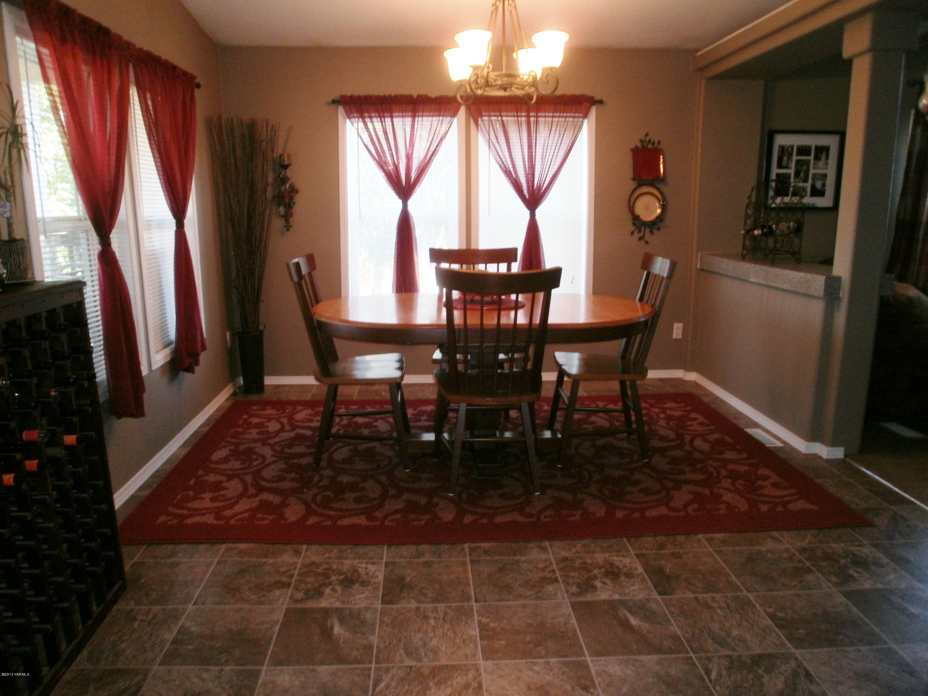 1771 Stone Road Yakima, WA 98908 - Photo 22 of 45 a view of a dining room with furniture and window