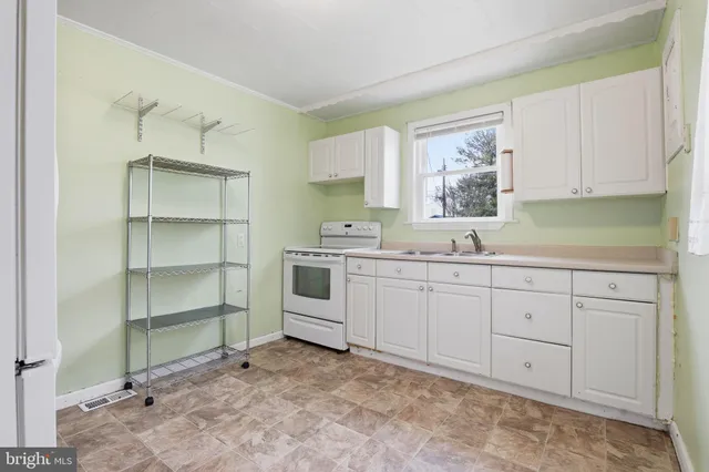a kitchen with a cabinets and window