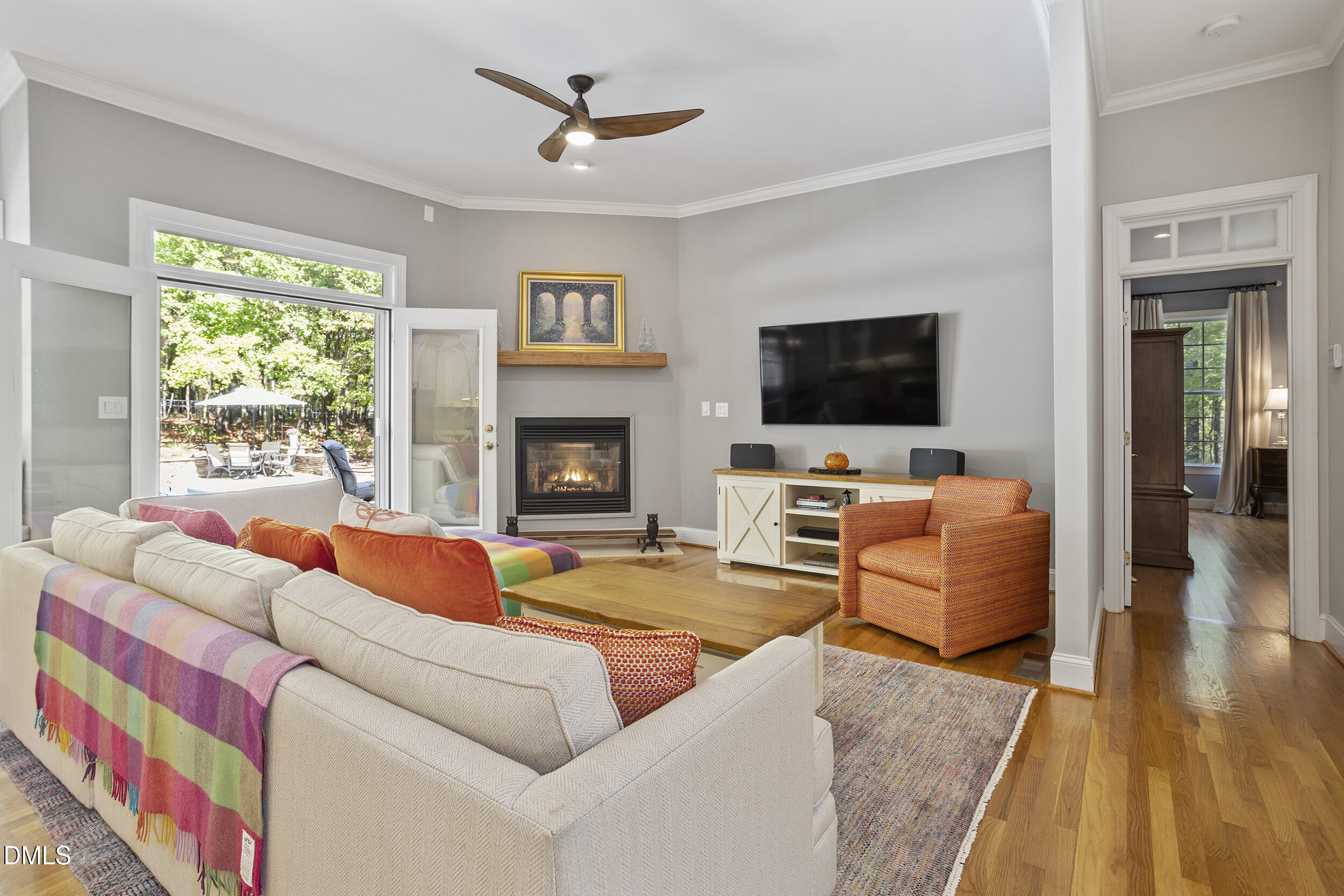 905 Olde Thompson Creek Road Apex, NC 27523 - Photo 19 of 67 a living room with furniture and a flat screen tv