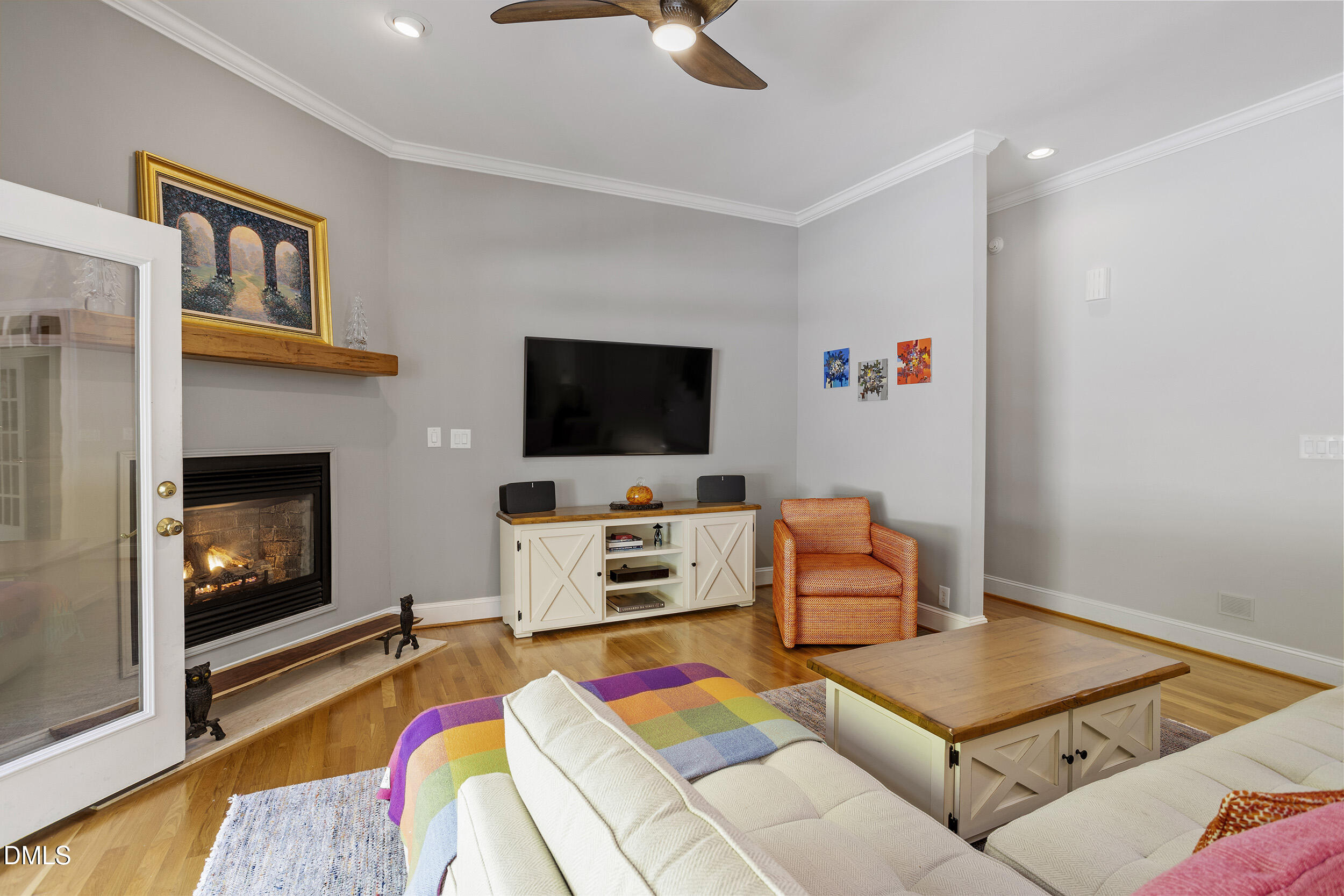 905 Olde Thompson Creek Road Apex, NC 27523 - Photo 20 of 67 a living room with furniture and a flat screen tv