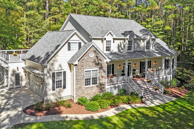 a view of a swimming pool with an outdoor seating