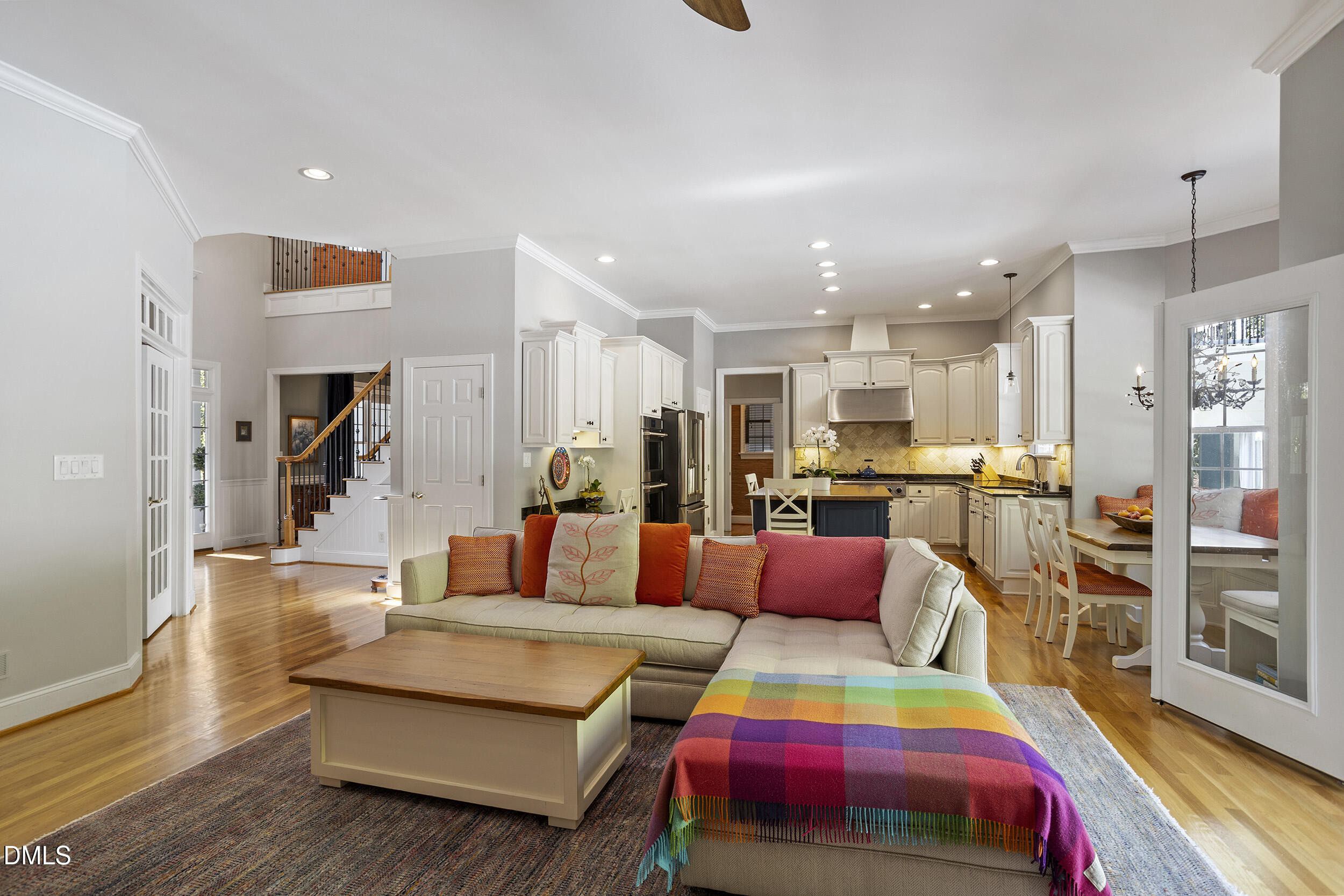 905 Olde Thompson Creek Road Apex, NC 27523 - Photo 21 of 67 a living room with furniture and kitchen view