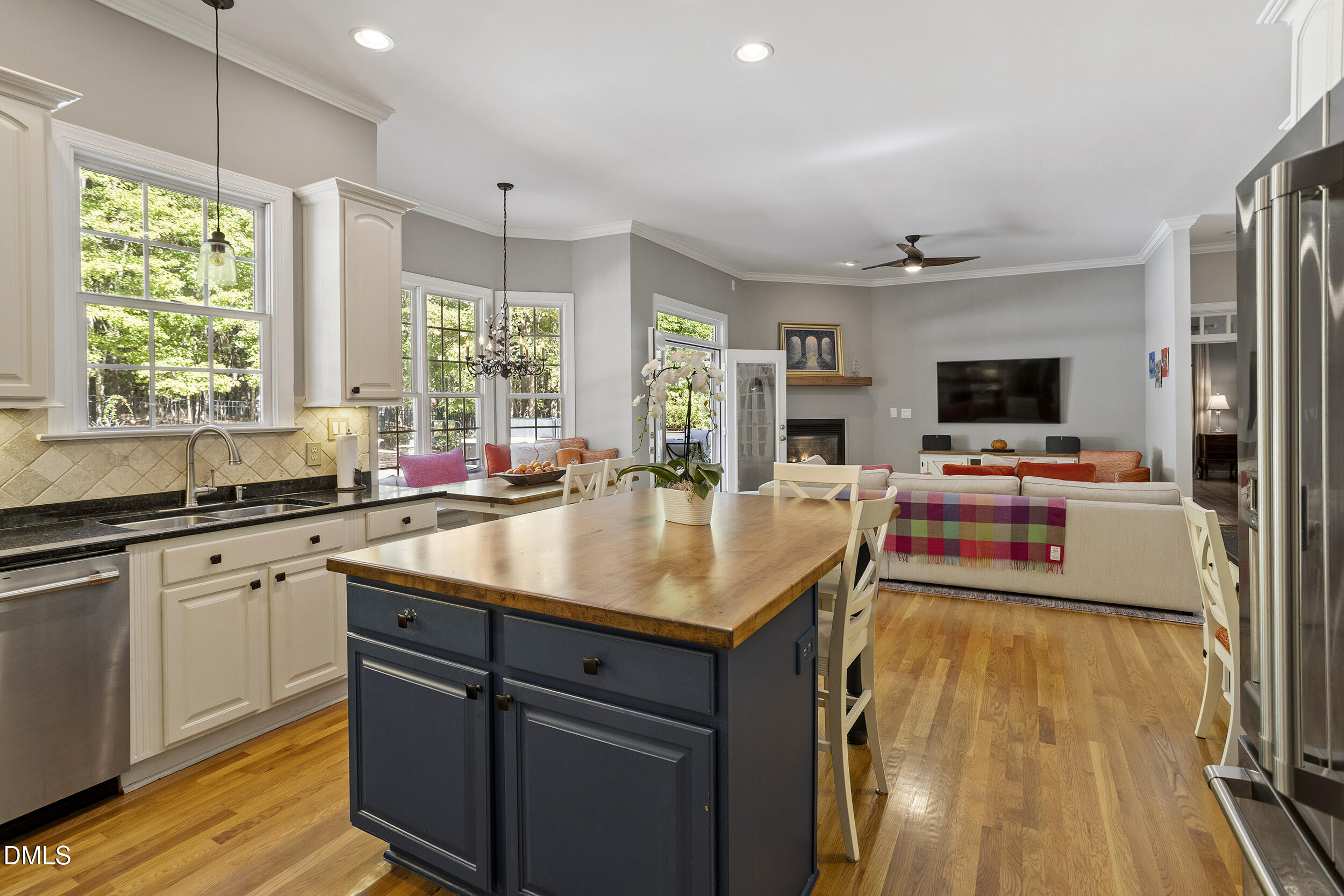 905 Olde Thompson Creek Road Apex, NC 27523 - Photo 22 of 67 a kitchen with a sink appliances and a counter top space