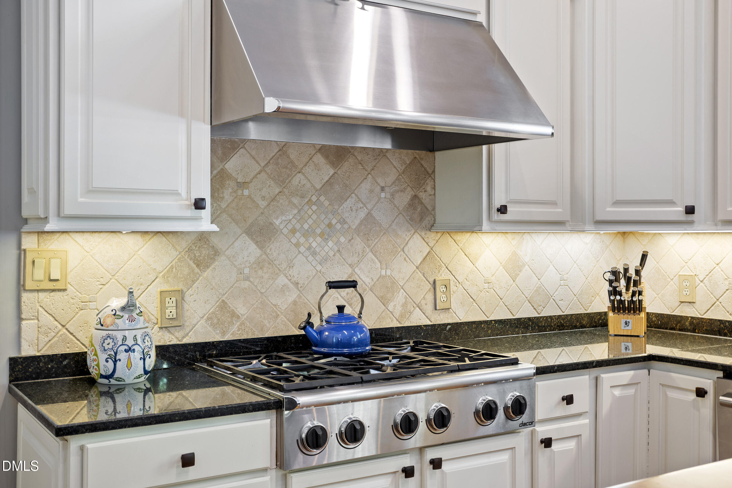 905 Olde Thompson Creek Road Apex, NC 27523 - Photo 28 of 67 a kitchen with granite countertop a stove sink and cabinets