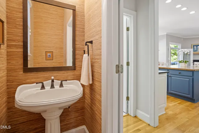 a bathroom with a granite countertop sink a shower and a mirror