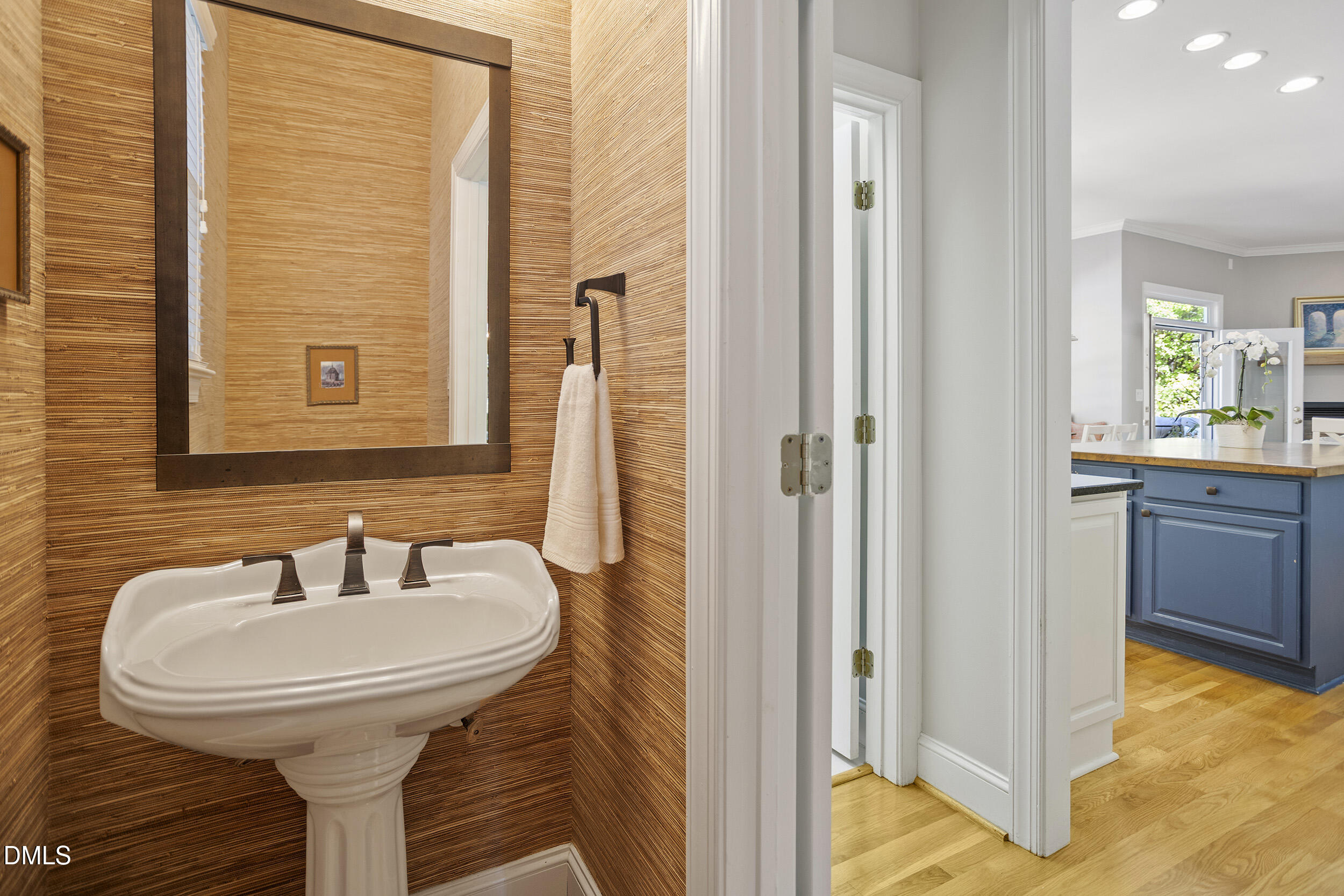 905 Olde Thompson Creek Road Apex, NC 27523 - Photo 31 of 67 a bathroom with a sink and a mirror