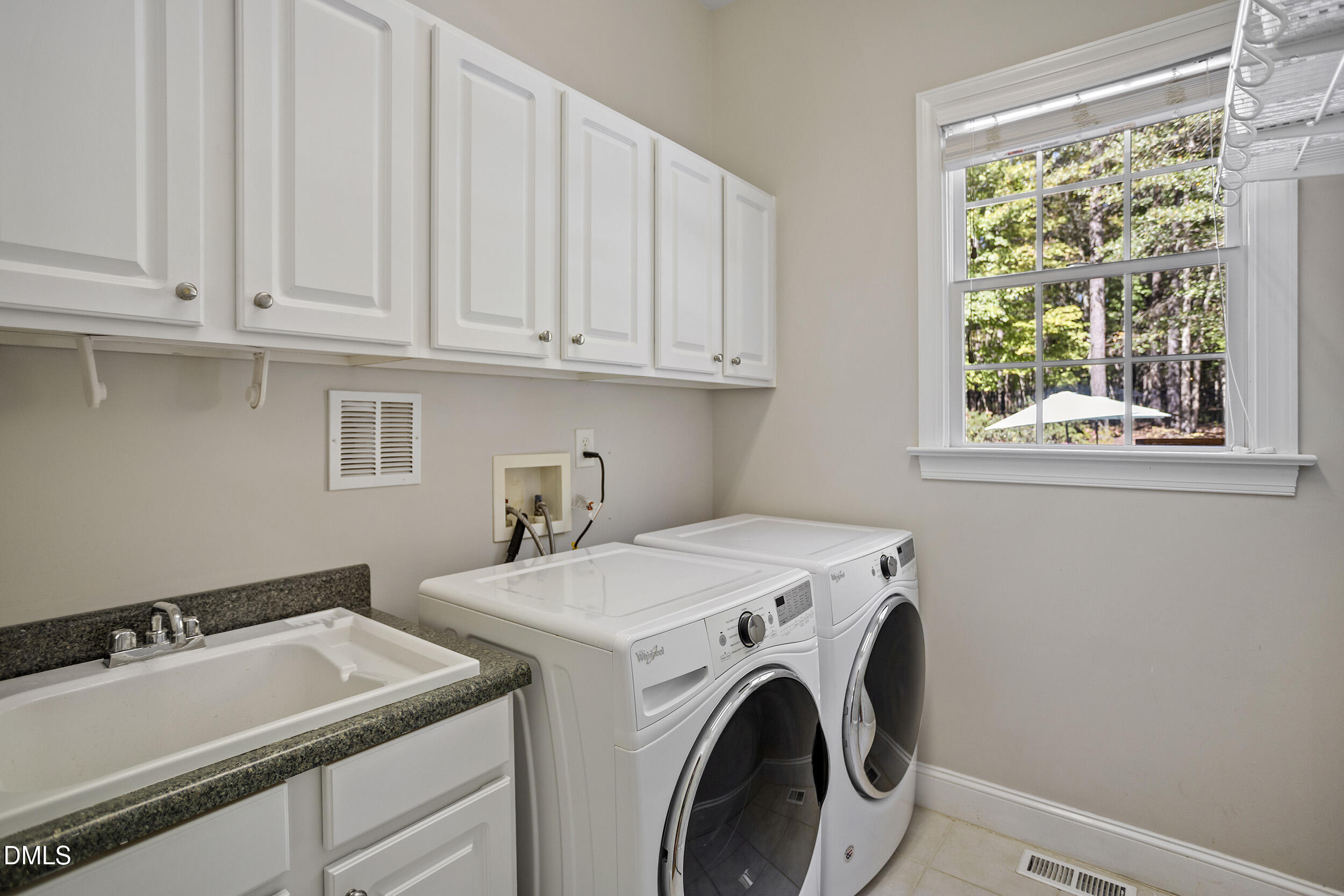 905 Olde Thompson Creek Road Apex, NC 27523 - Photo 32 of 67 a utility room with dryer and washer