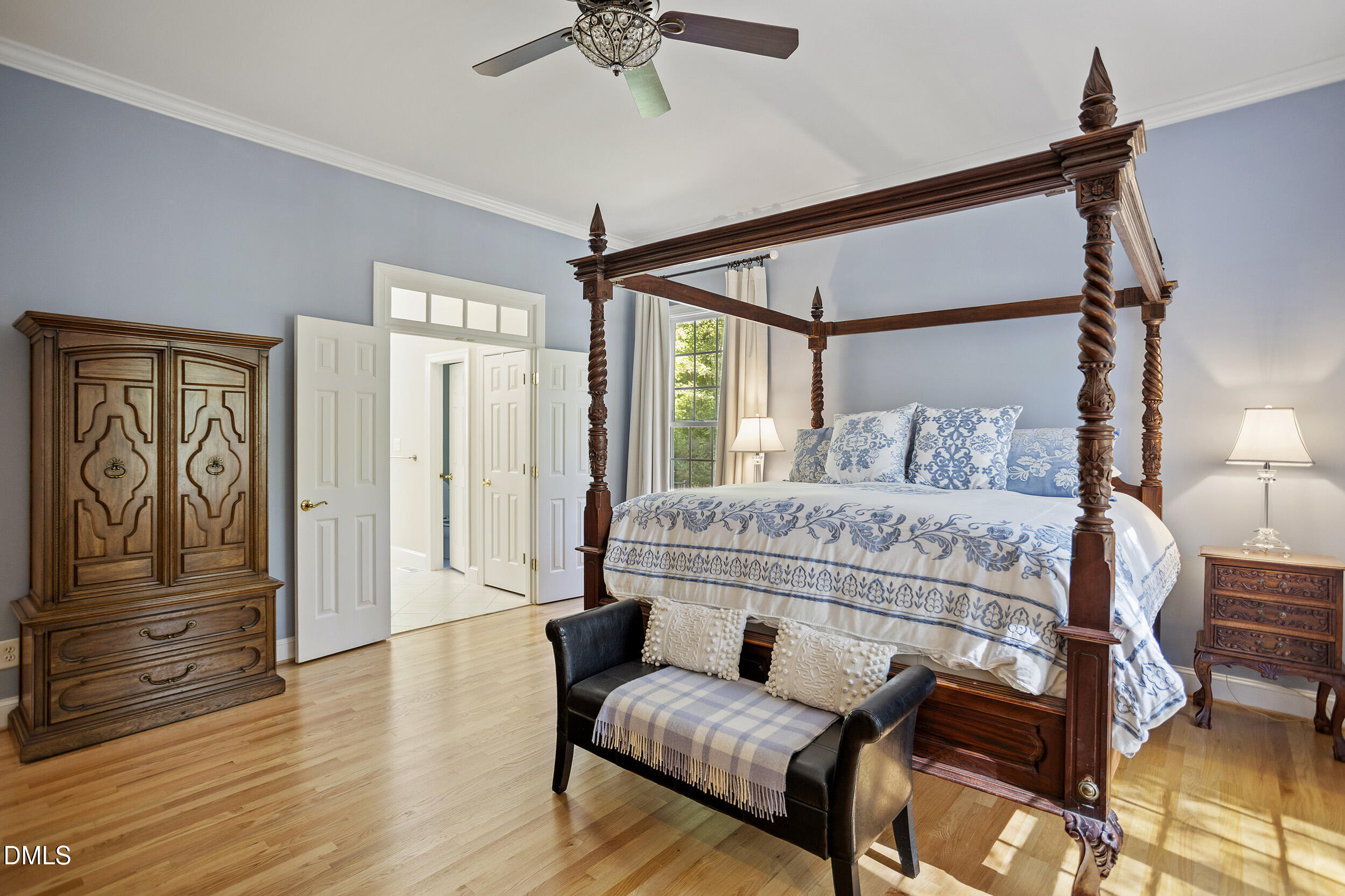 905 Olde Thompson Creek Road Apex, NC 27523 - Photo 34 of 67 a bedroom with a bed and wooden floor