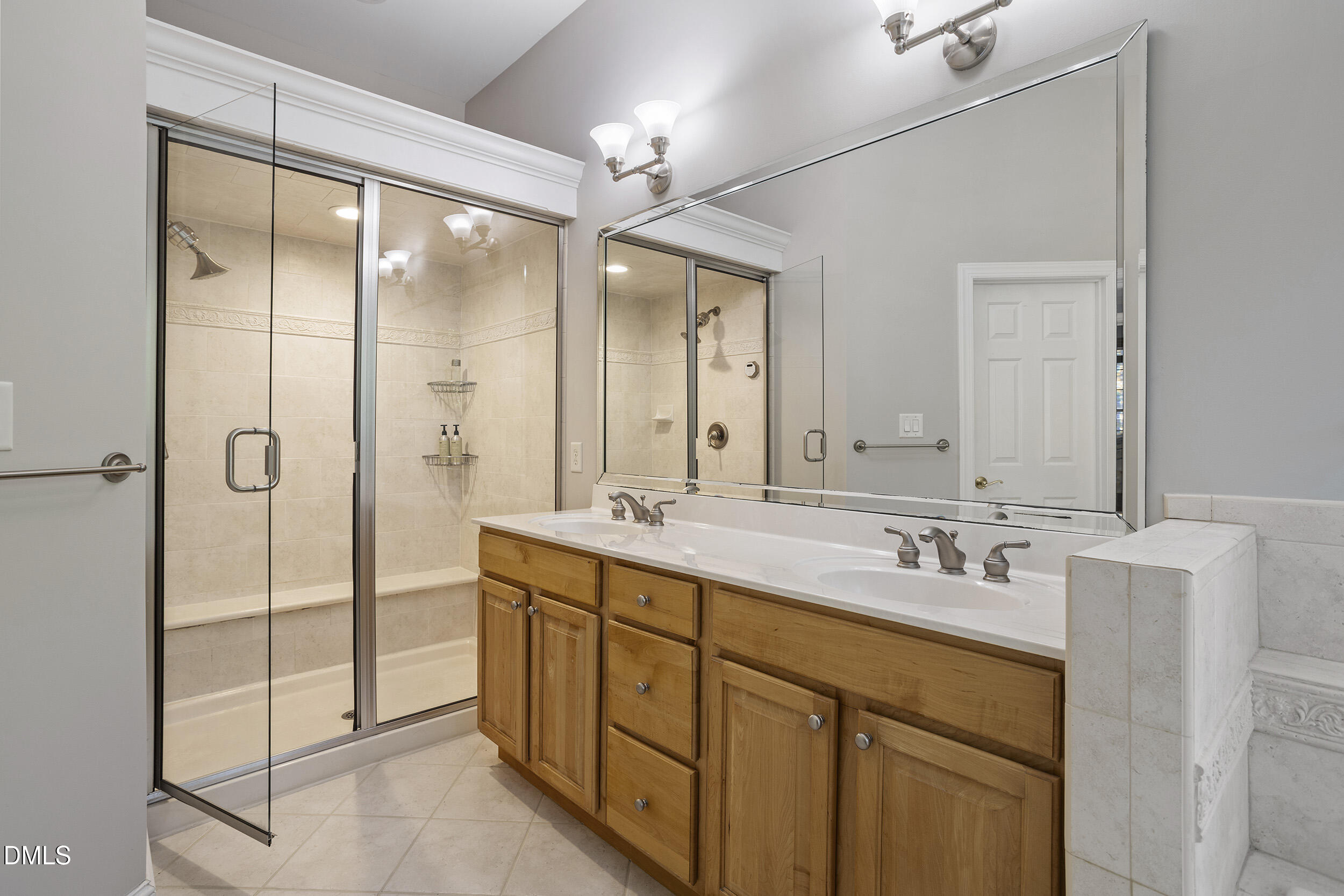 905 Olde Thompson Creek Road Apex, NC 27523 - Photo 38 of 67 a bathroom with a double vanity sink mirror and double