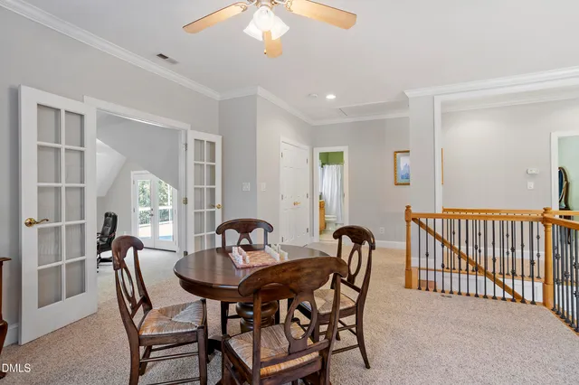 a view of a balcony with wooden floor and fence