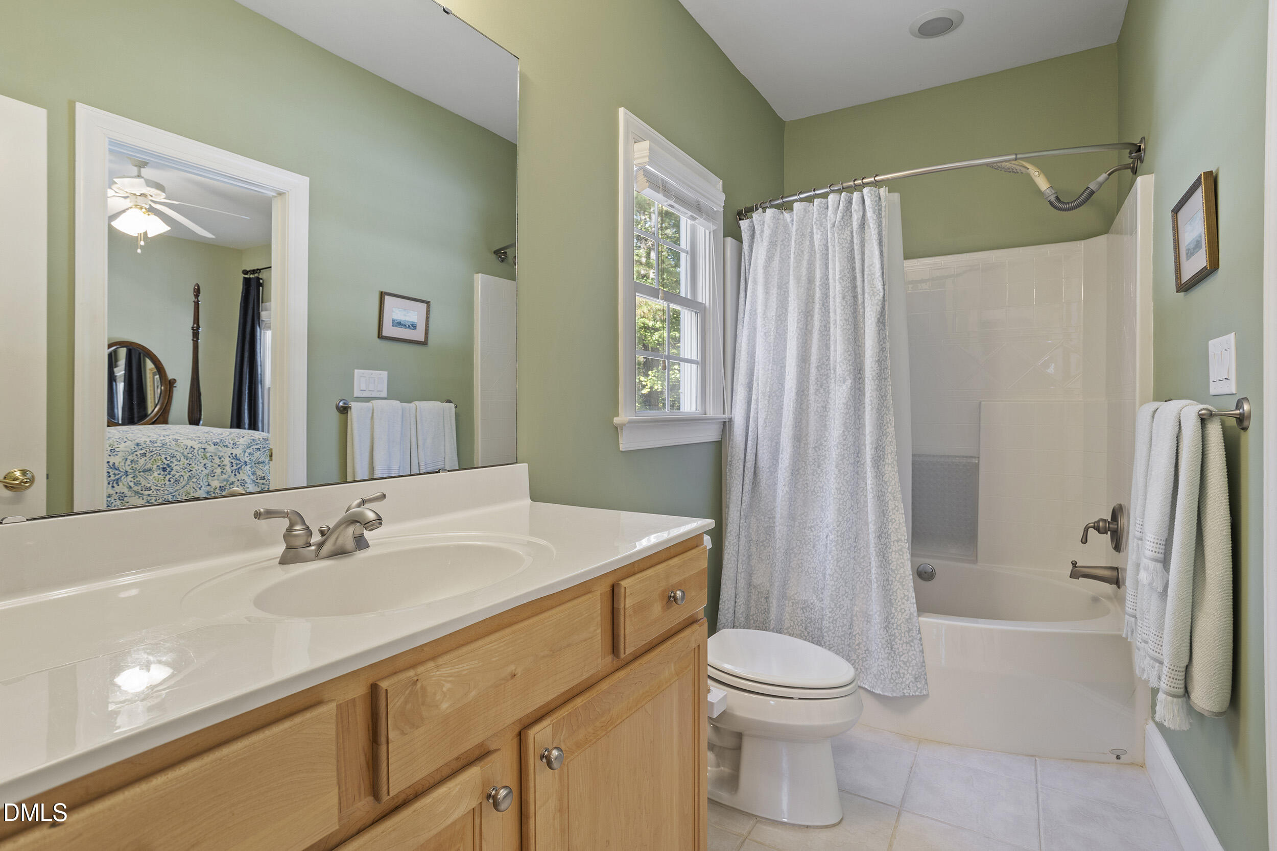 905 Olde Thompson Creek Road Apex, NC 27523 - Photo 47 of 67 a bathroom with a sink a toilet and shower