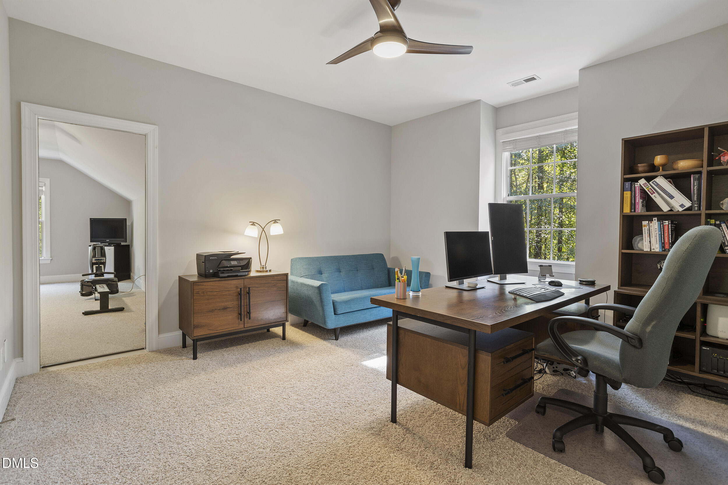 905 Olde Thompson Creek Road Apex, NC 27523 - Photo 49 of 67 a view of a workspace with furniture and a window