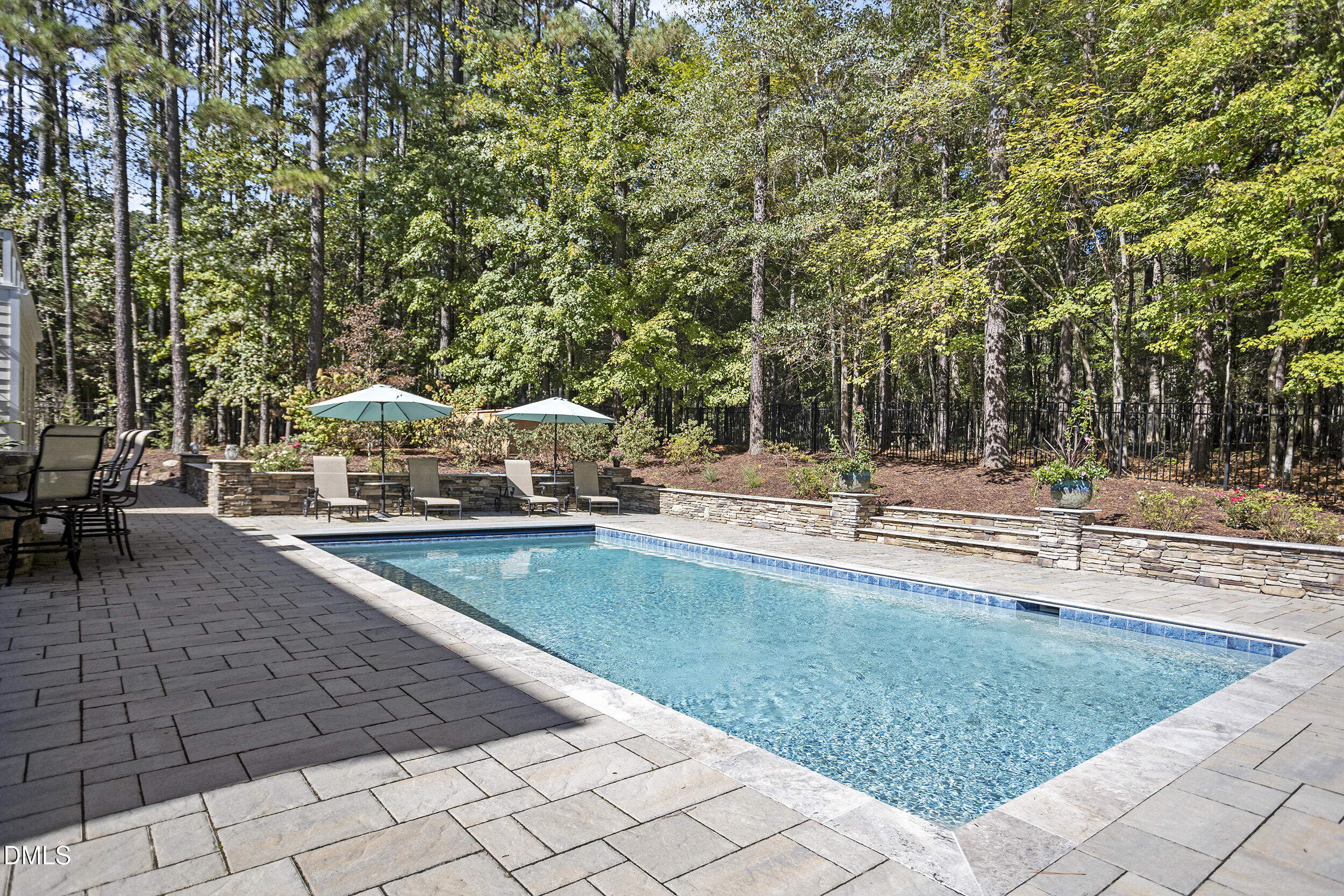 905 Olde Thompson Creek Road Apex, NC 27523 - Photo 5 of 67 a view of a swimming pool with an outdoor seating