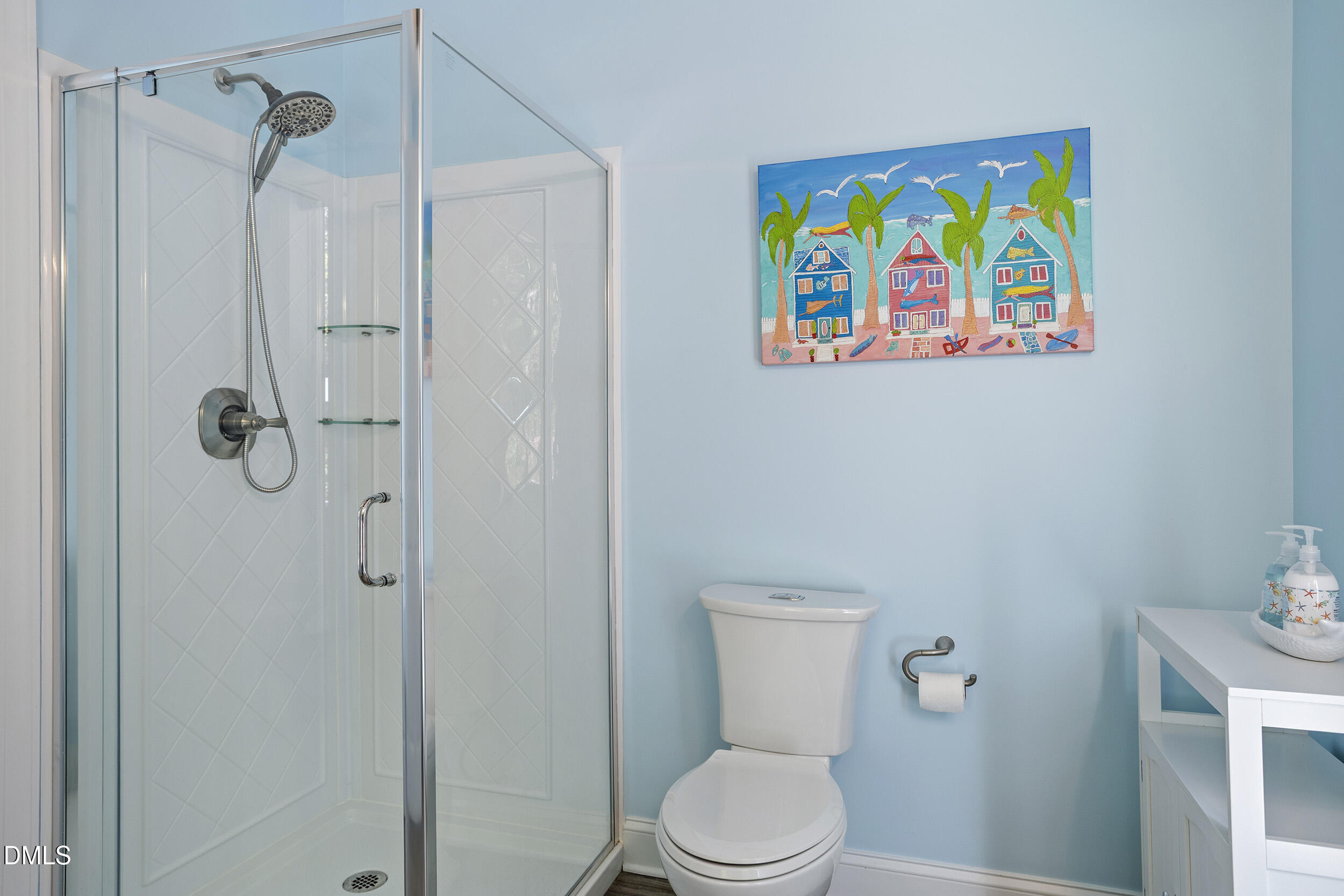905 Olde Thompson Creek Road Apex, NC 27523 - Photo 54 of 67 a white toilet sitting next to a bathroom sink