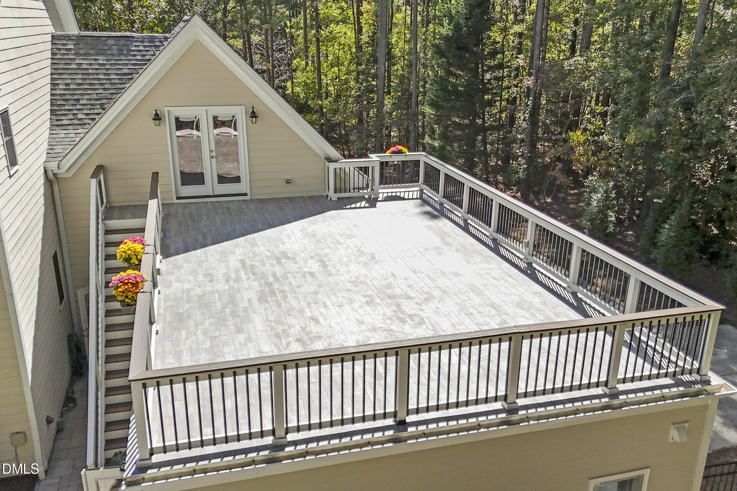 905 Olde Thompson Creek Road Apex, NC 27523 - Photo 56 of 67 a view of a balcony with wooden floor and fence
