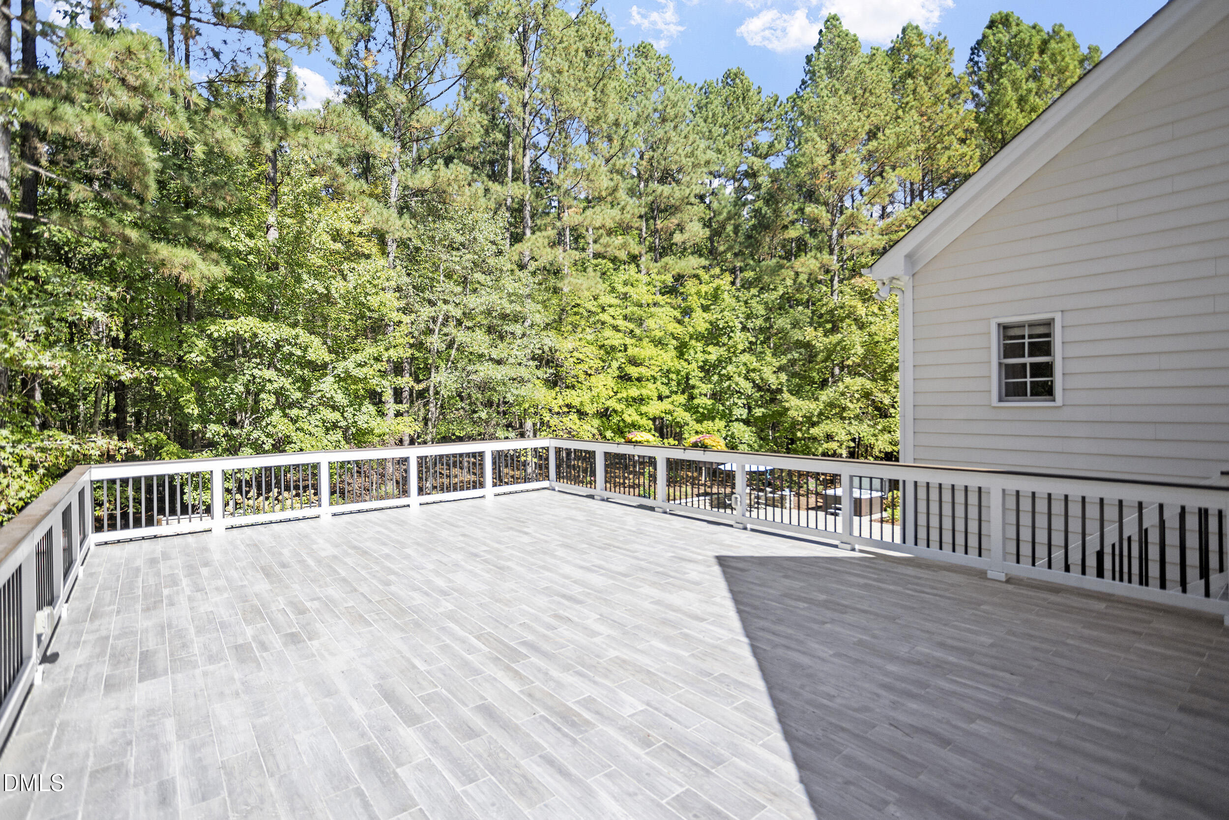 905 Olde Thompson Creek Road Apex, NC 27523 - Photo 57 of 67 a view of a balcony with wooden floor and fence