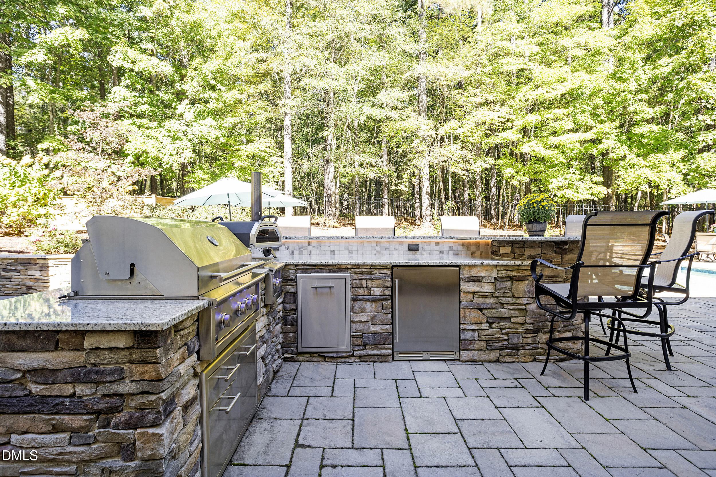 905 Olde Thompson Creek Road Apex, NC 27523 - Photo 62 of 67 a view of a chairs and table on the patio