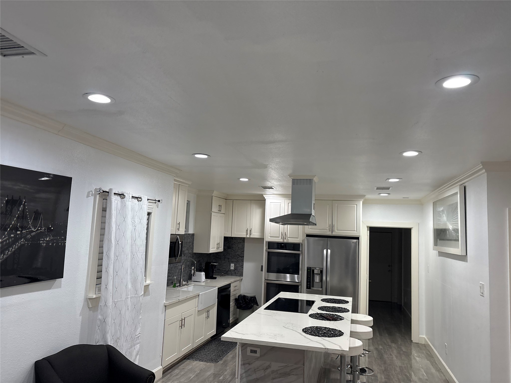 3021 Gray Street Houston, TX 77004 - Photo 11 of 44 a kitchen with a refrigerator and a stove top oven