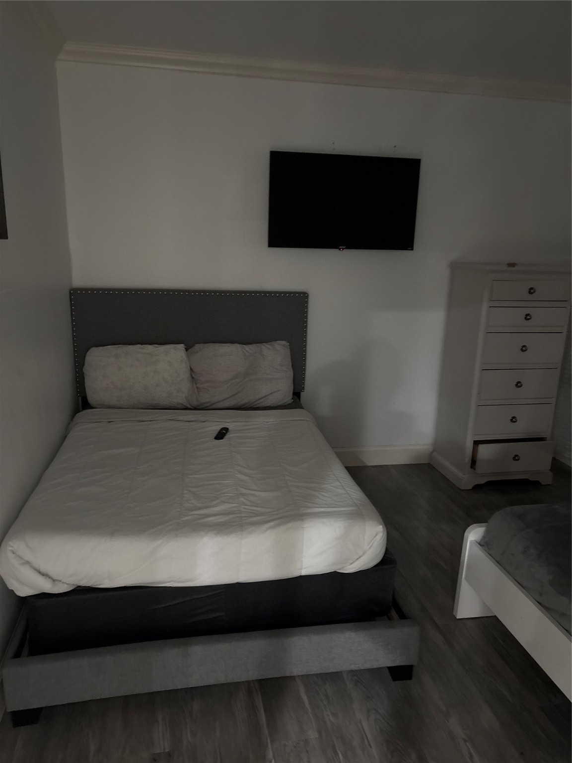 3021 Gray Street Houston, TX 77004 - Photo 19 of 37 a room with a bed and a television