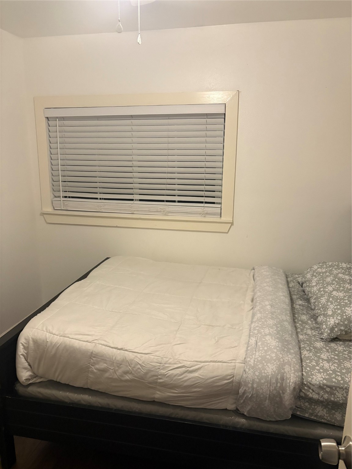 3021 Gray Street Houston, TX 77004 - Photo 26 of 37 a bed sitting in a bedroom next to a window