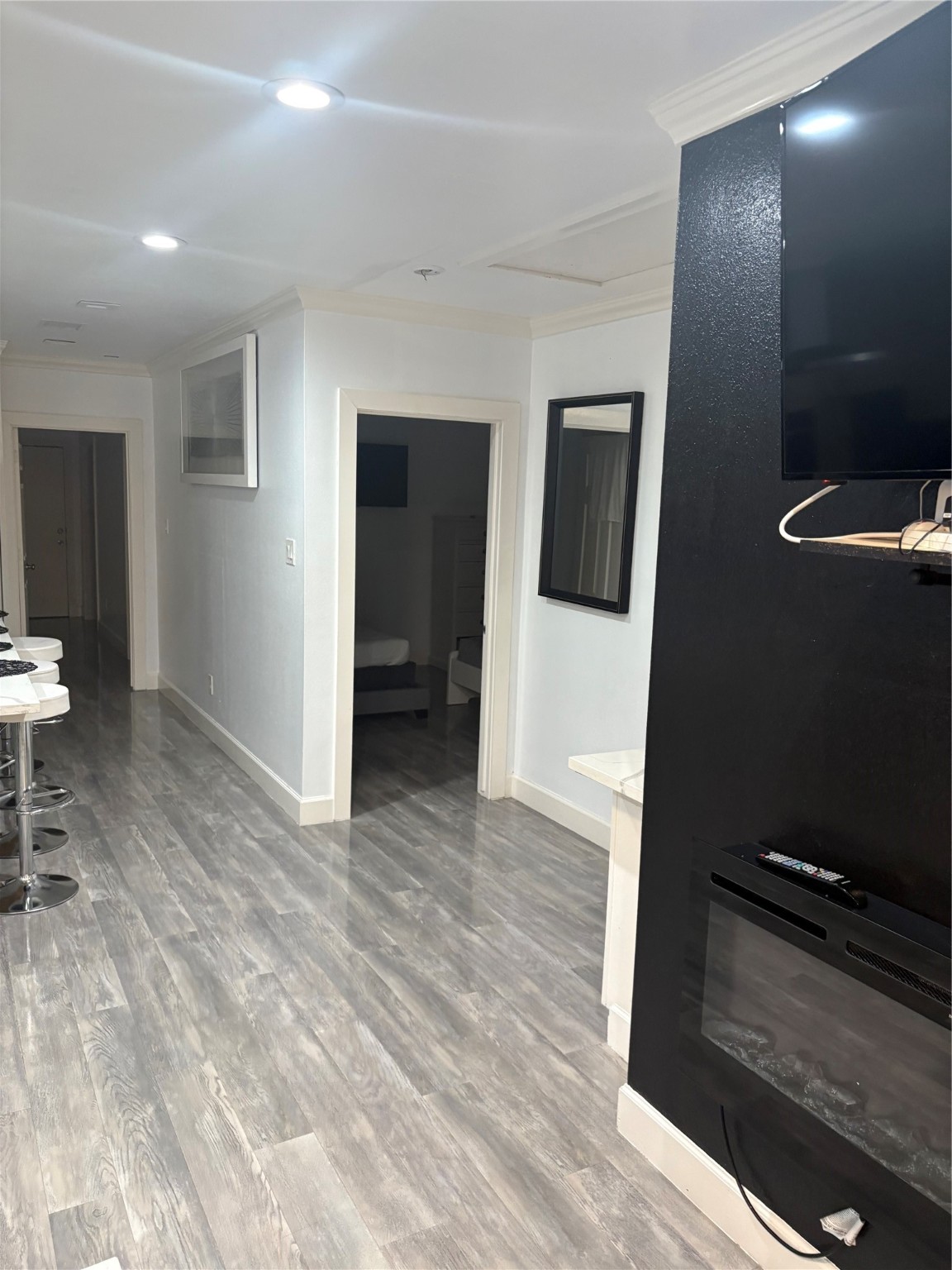 3021 Gray Street Houston, TX 77004 - Photo 37 of 37 an empty room with wooden floor and bathroom