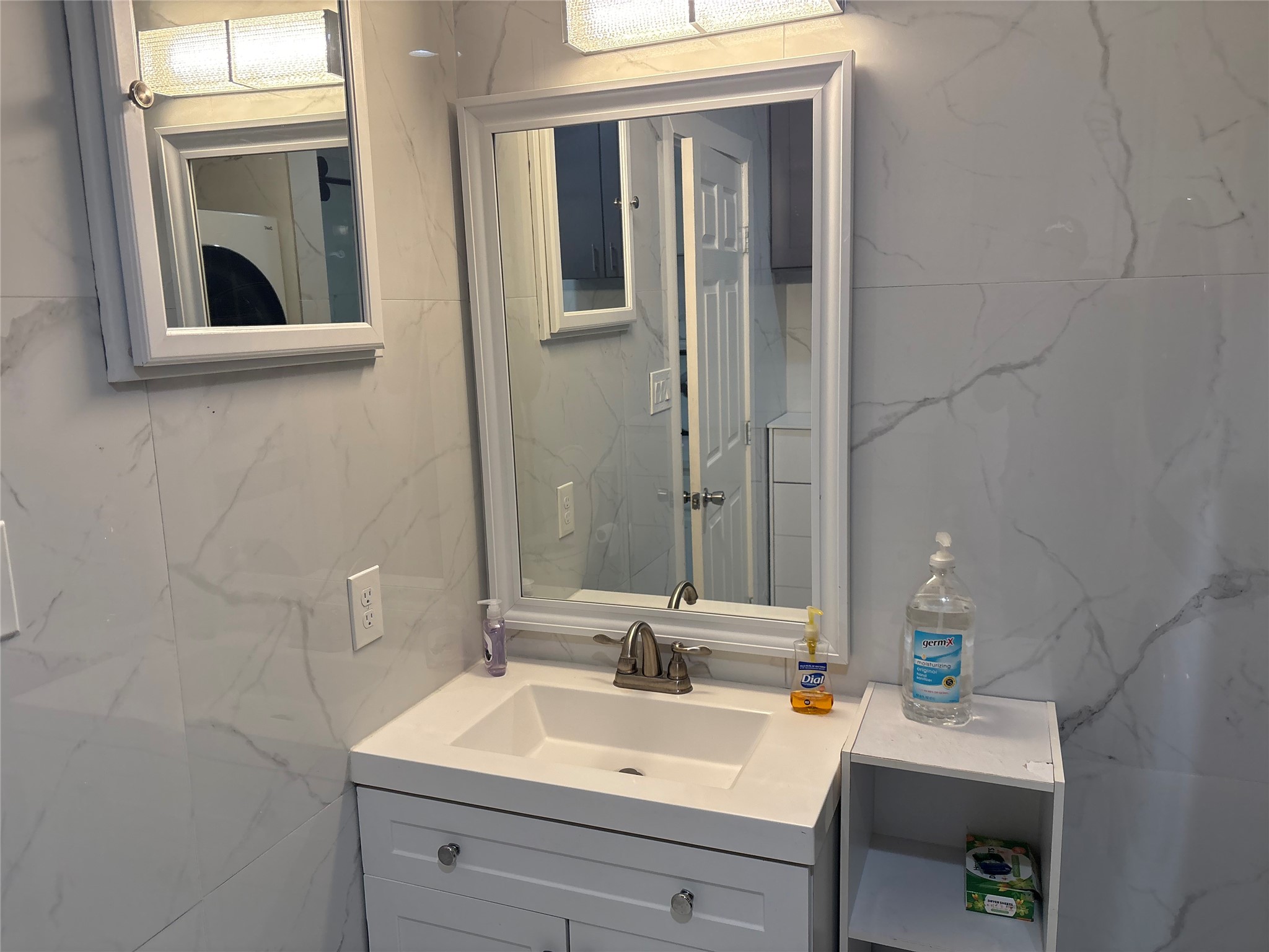 3021 Gray Street Houston, TX 77004 - Photo 40 of 44 a bathroom with a sink and a mirror