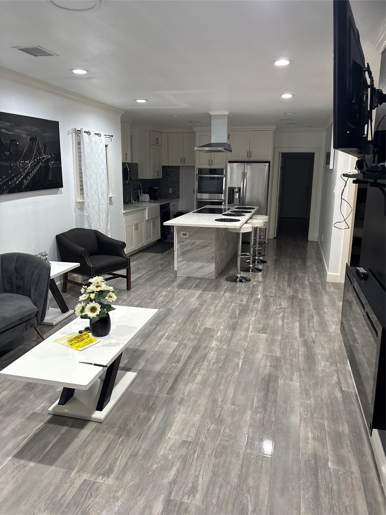 3021 Gray Street Houston, TX 77004 - Photo 44 of 44 a living room with furniture and a flat screen tv