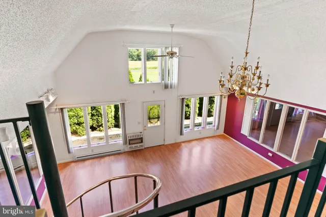 a view of an entryway with wooden floor