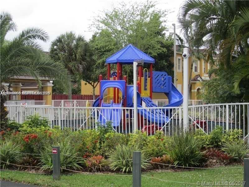 60 Southeast 6th Road, Unit 60 Homestead, FL 33030 - Photo 14 of 15 a view of a wooden house with a yard and furniture