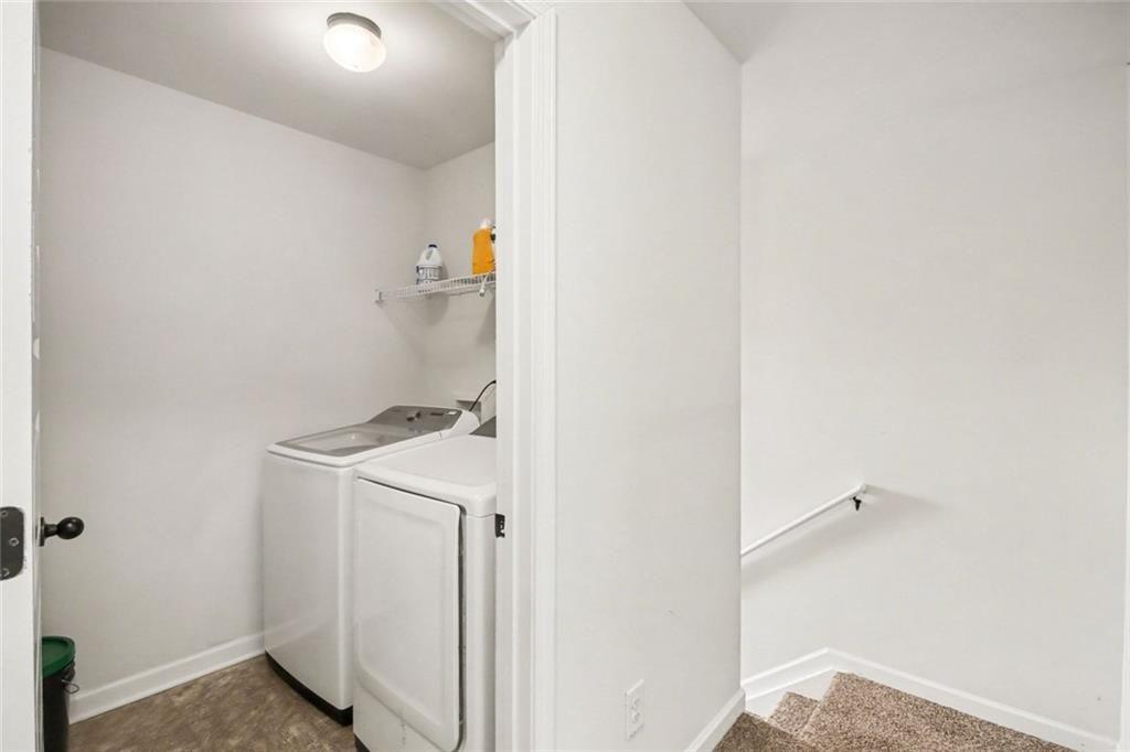 767 Effendi Place Fairburn, GA 30213 - Photo 26 of 35 a bathroom with a sink and a mirror