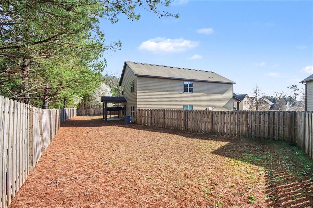 767 Effendi Place Fairburn, GA 30213 - Photo 33 of 35 a backyard of a house