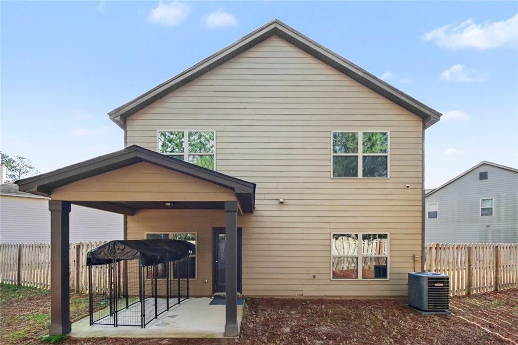 767 Effendi Place Fairburn, GA 30213 - Photo 35 of 35 a view of a house with wooden fence