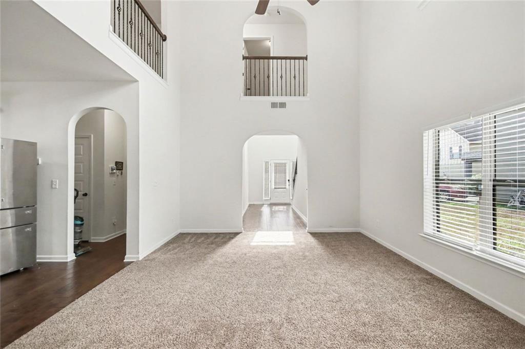767 Effendi Place Fairburn, GA 30213 - Photo 10 of 35 a view of a livingroom with an empty space and a window