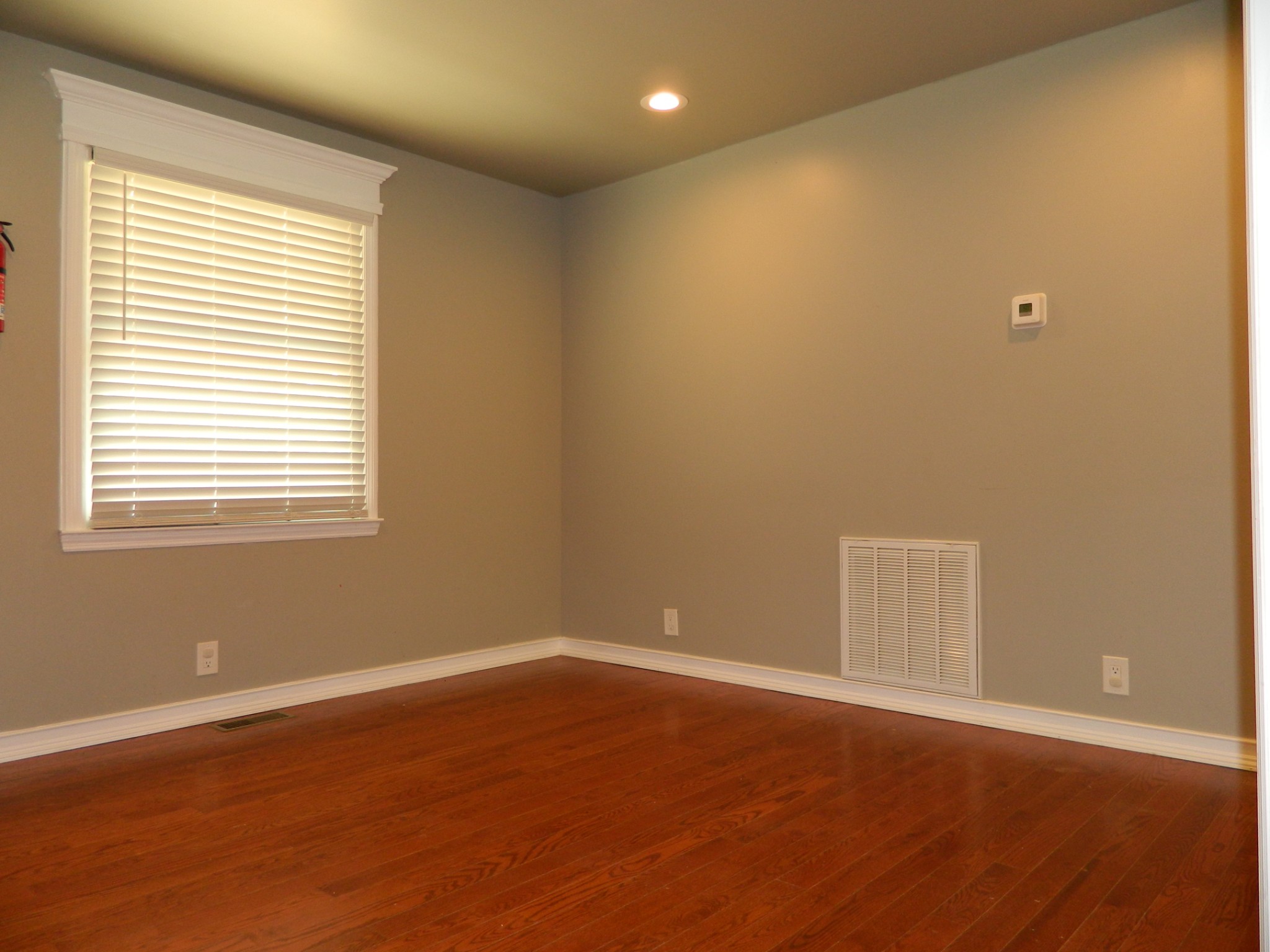 2128 Sanders Road Clarksville, TN 37043 - Photo 12 of 21 a view of an empty room with wooden floor and a window