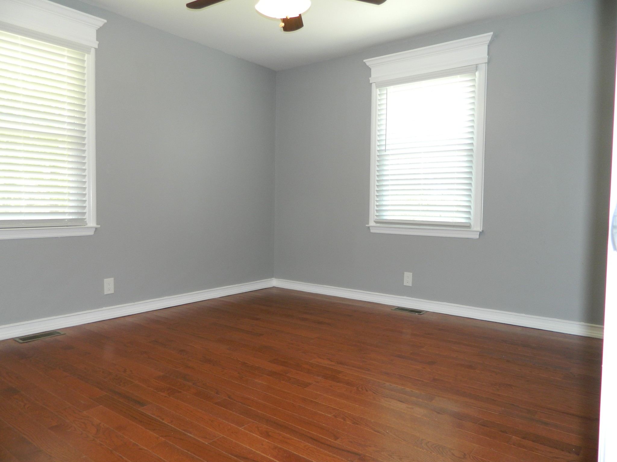 2128 Sanders Road Clarksville, TN 37043 - Photo 14 of 21 an empty room with wooden floor and windows