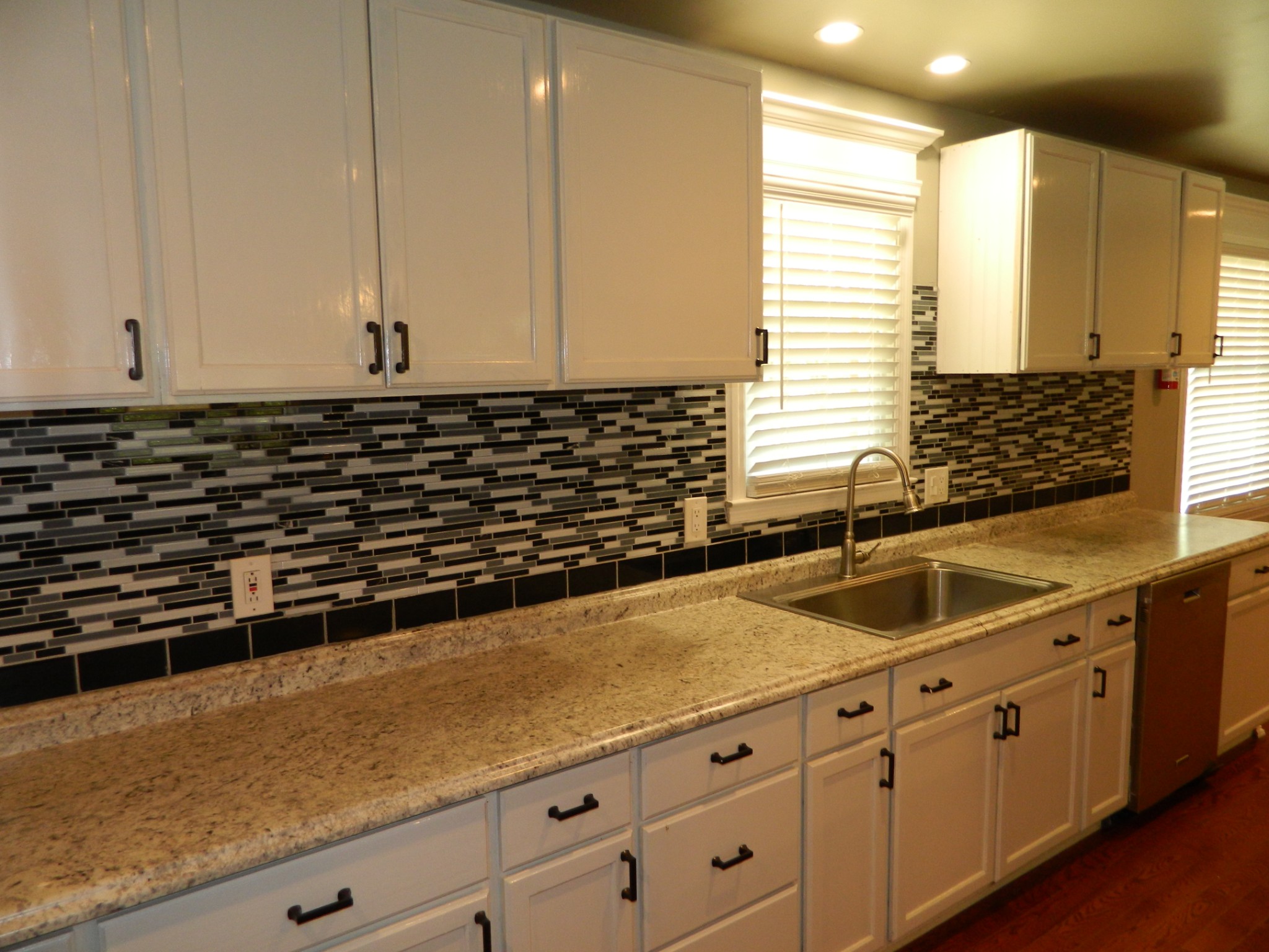 2128 Sanders Road Clarksville, TN 37043 - Photo 6 of 21 a kitchen with granite countertop a sink and a white wooden cabinets