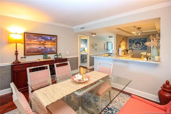 a dining room with a table and chairs
